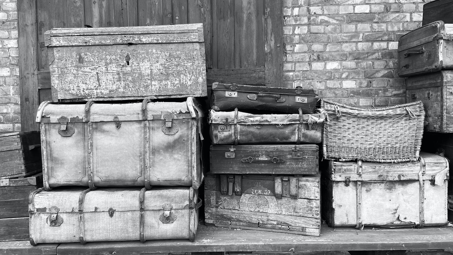 grayscale photo of wooden crates